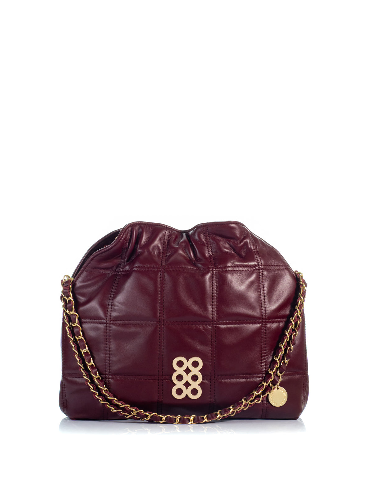 KOORELOO The Milano Shopper in burgundy leather with geometric stitching, gathered top, signature gold-tone emblem and leather-interwoven chain strap