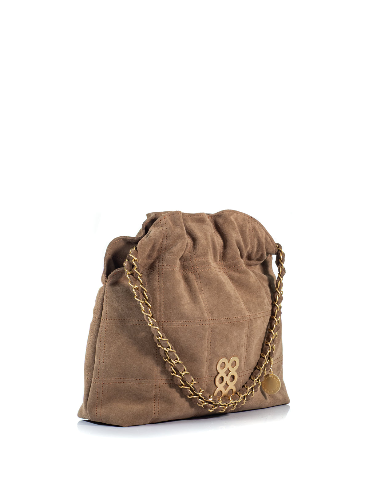Side view of the KOORELOO Milano Shopper in brown suede with geometric stitching, gathered top, signature gold-tone emblem and suede-interwoven chain strap