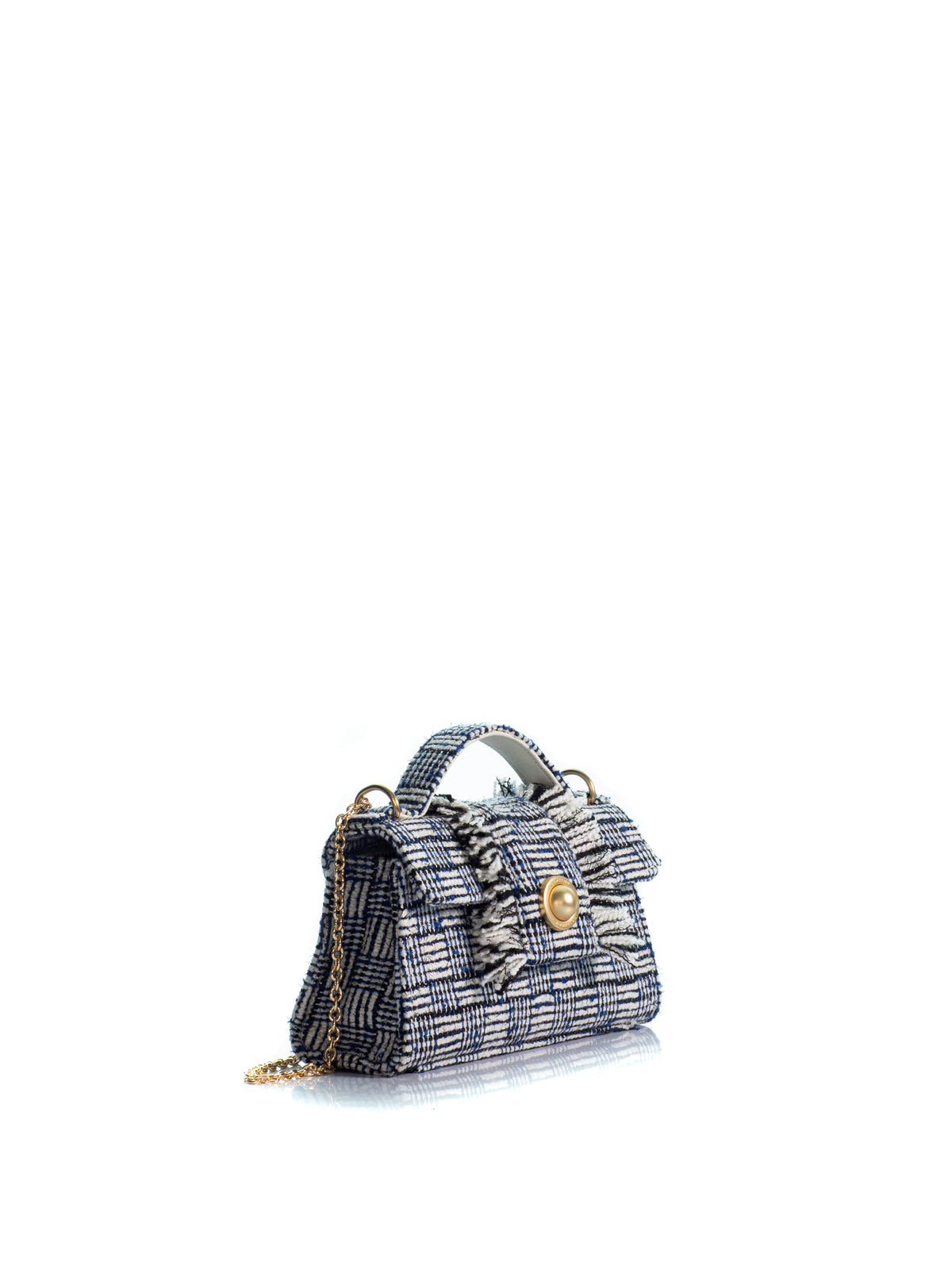 Side view of the KOORELOO Noble Mini in navy and ivory tweed with geometric woven pattern, fringed front detailing, top handle, signature gold-tone closure and chain strap
