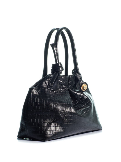 Side view of the KOORELOO Swan 2.0 Maxi in black croc-effect leather with glossy embossed texture, sculptural silhouette, knotted top handle and gold-tone circular detail