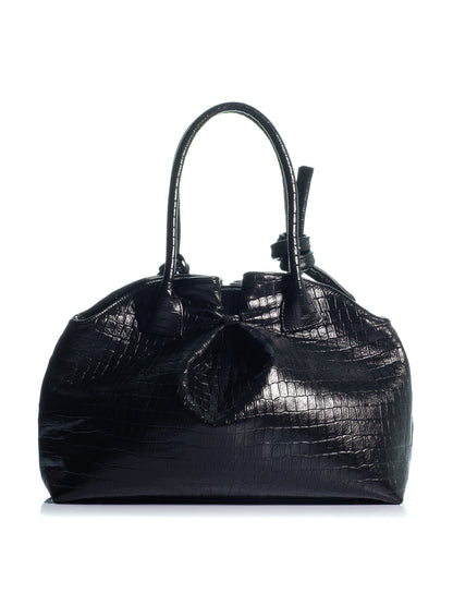 Back view of the KOORELOO Swan 2.0 Maxi in black croc-effect leather with glossy embossed texture, sculptural silhouette, knotted top handle and gold-tone circular detail