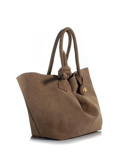 Side view of the KOORELOO Swan Belle Maxi in brown suede with spacious flared silhouette, double knotted shoulder handles and signature gold-tone circular detail