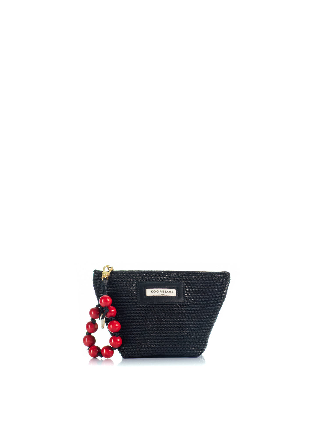 The Kooreloo Charming Pouch in black raffia with red beaded charm on a white background