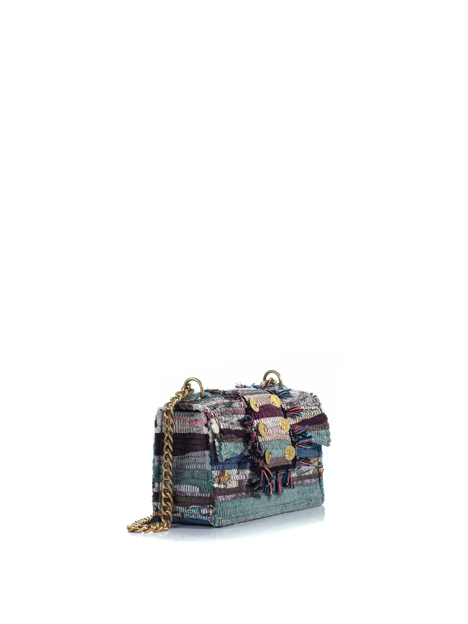 Side view of The New Yorker Soho Multi rag-rug handbag with multicolor fringe, gold-tone coin details and chain strap